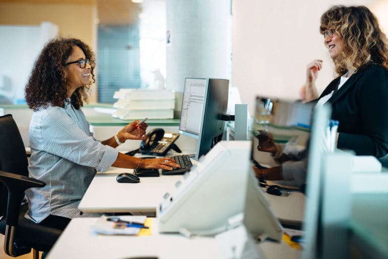 Woman paying a receptionist